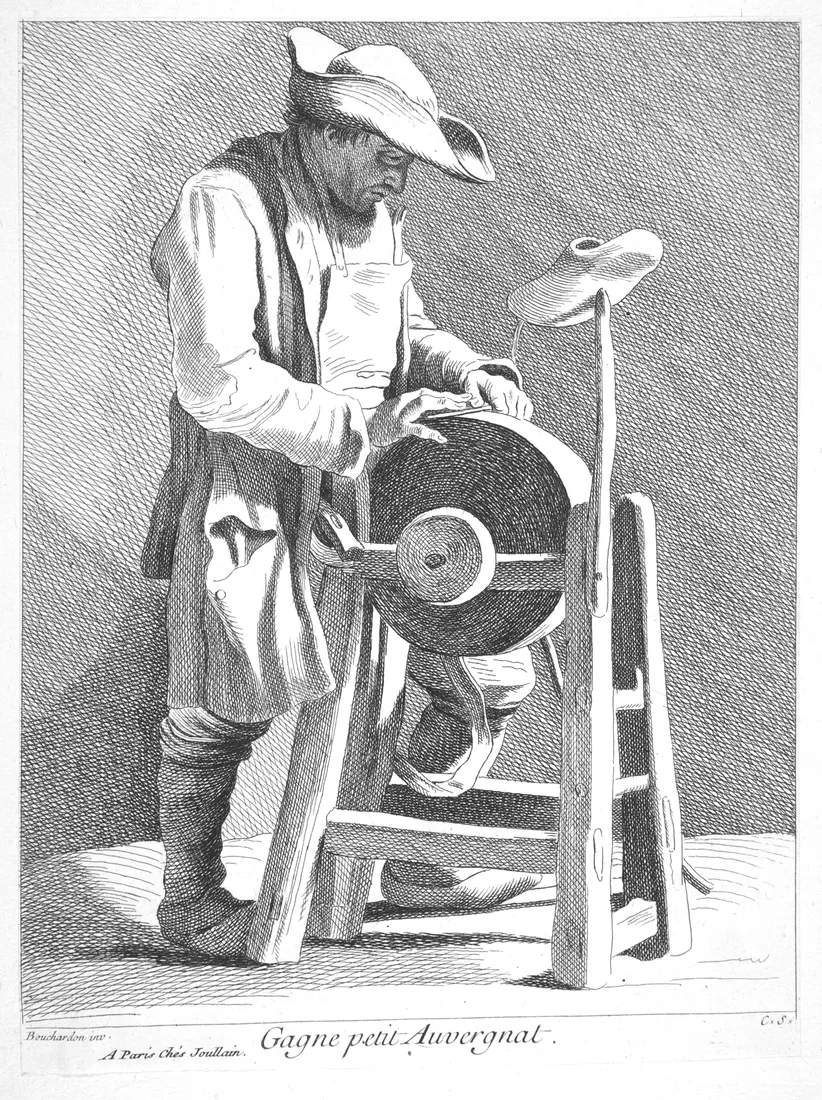 Etching of a man in a three-cornered hat and an apron, pressing a blade to a large grinding wheel set in a wooden frame.